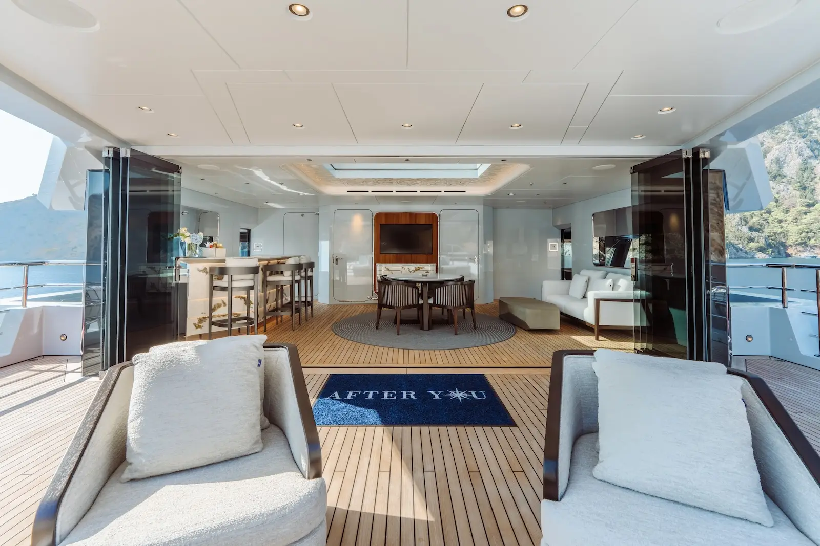 Principal living space with sculptural seating and long sightlines to the glazing