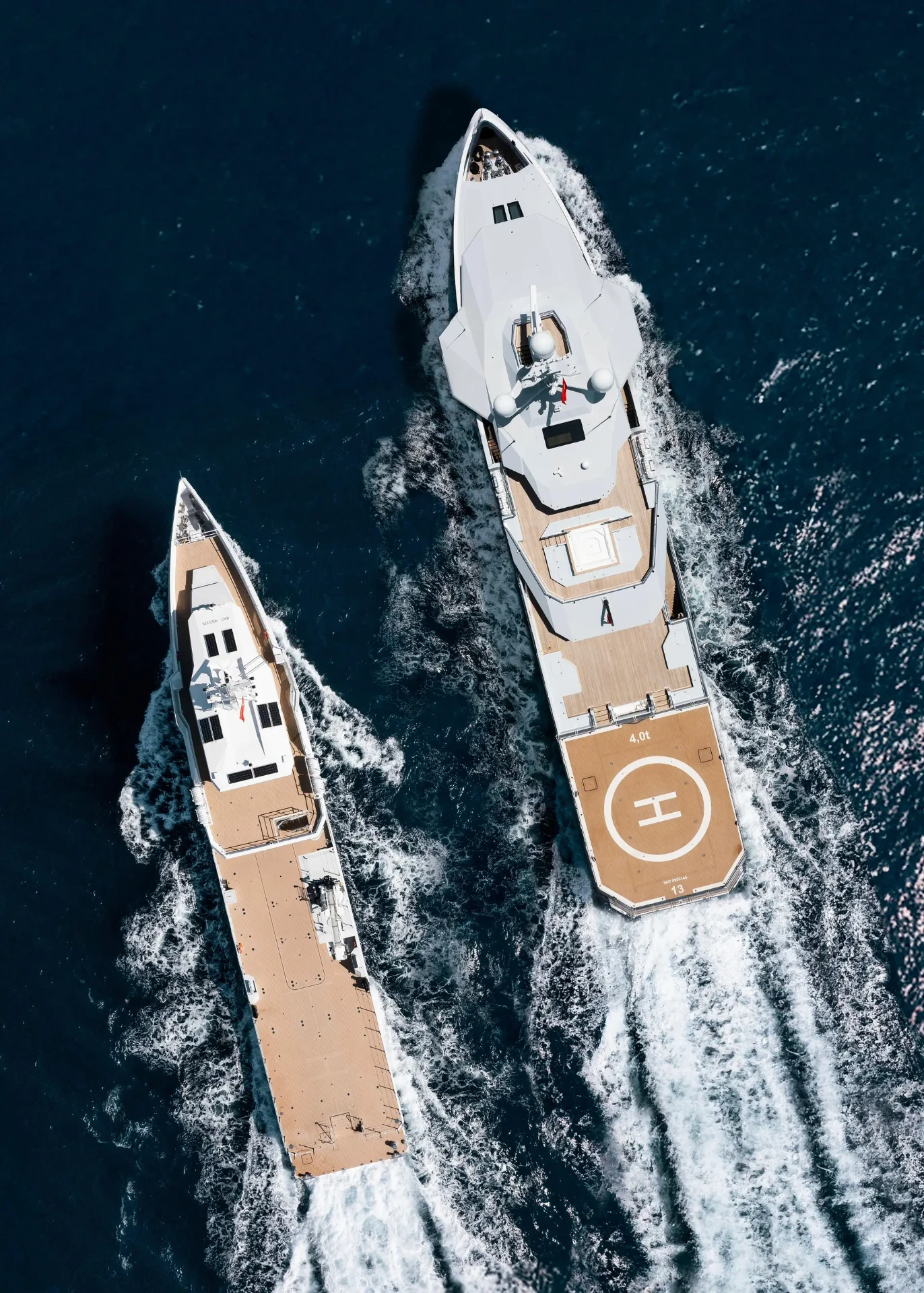 Vertical top-down aerial of AFTER YOU and her support vessel running side by side, helideck visible