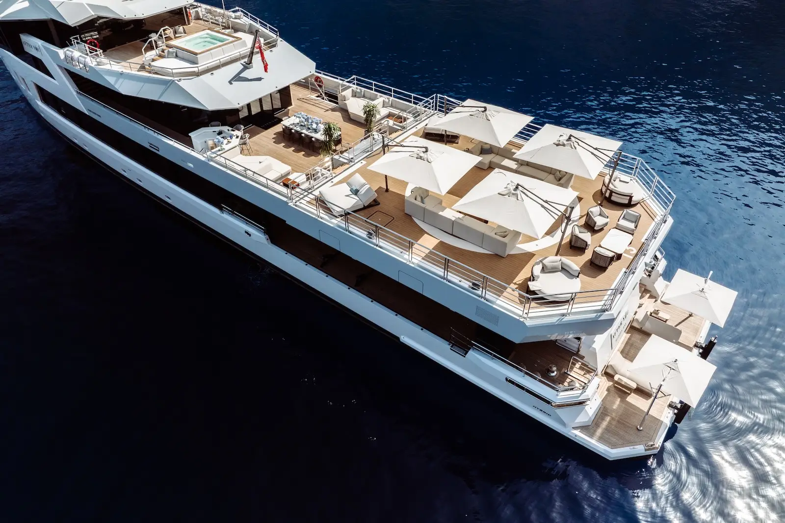 Top oblique aerial of the guest exterior decks over deep blue water